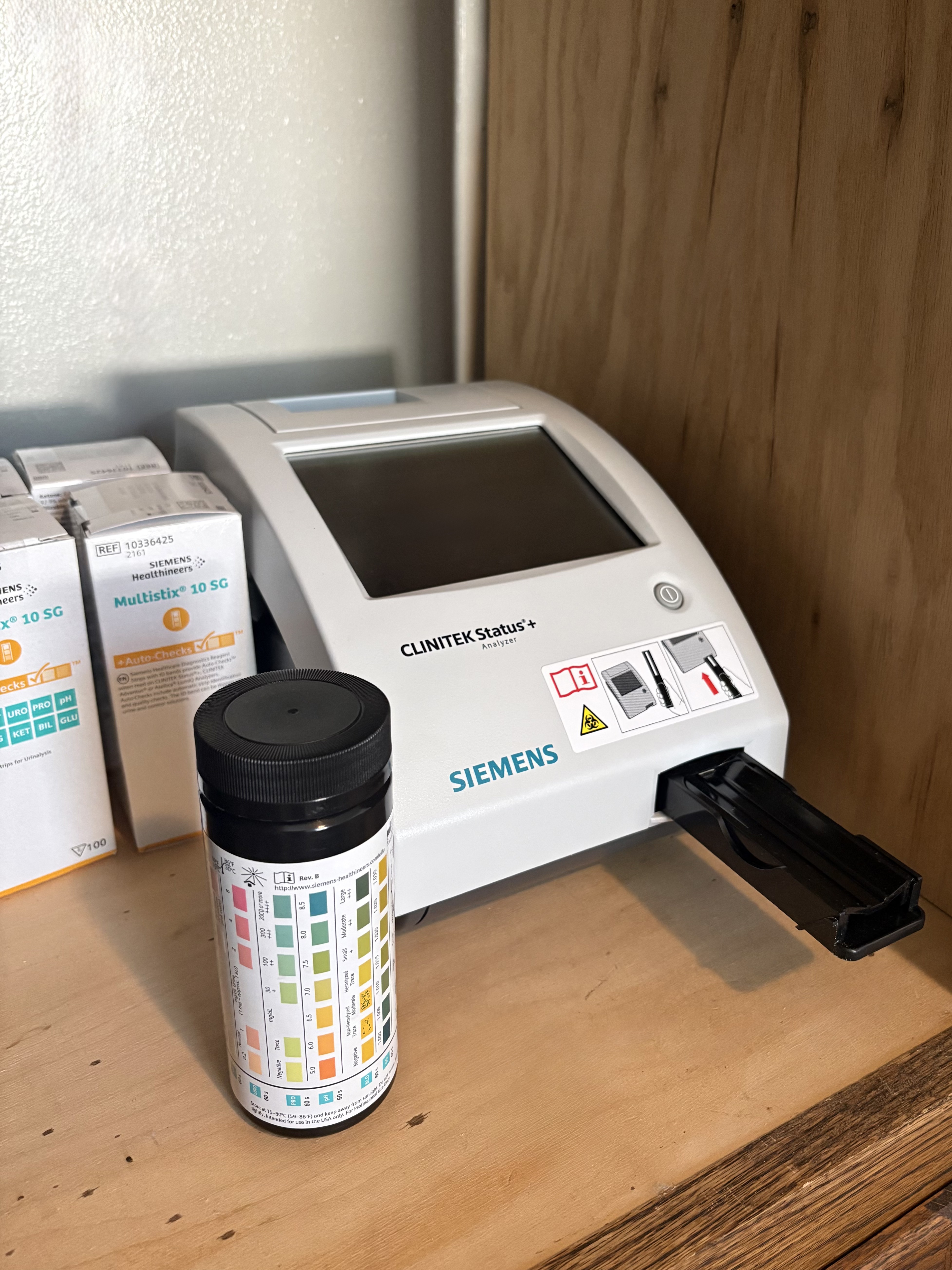 Urinalysis analyzer used during DOT physical exams at Restoration Chiropractic & Wellness in Griffin, Georgia